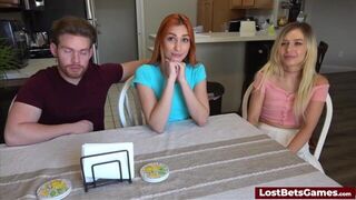 A redhead and a blonde lose a strip game and fuck the male winner - porn video